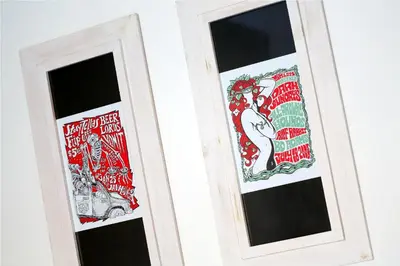 two glass doors with red and white graphics on them at 7 Bidadari Hotel Seminyak in Seminyak