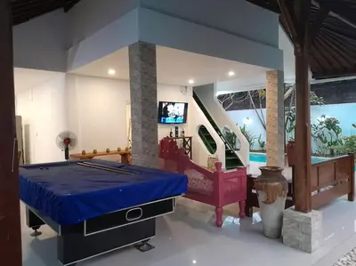 a bedroom with a bed and a tv in a room at 2BR private villa in Seminyak, Ayu Putri in Seminyak