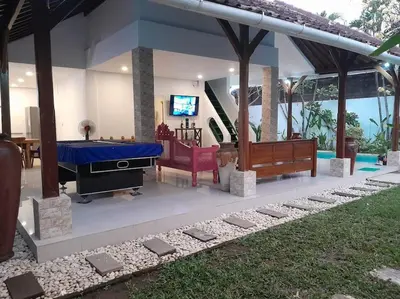 a house with a pool table and a tv in it at 2BR private villa in Seminyak, Ayu Putri in Seminyak