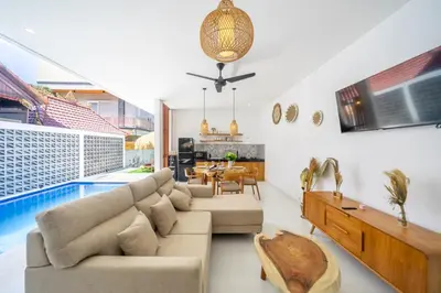 a living room with a couch and a table at New Modern Villa in Bali in Legian