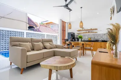 a living room with a couch and a table at New Modern Villa in Bali in Legian