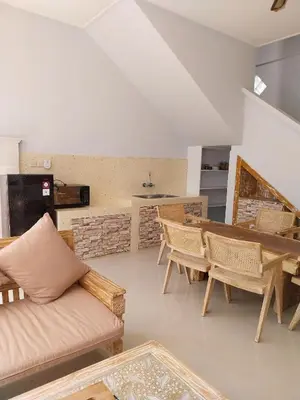 a living room with a couch and a table at Umah Kita Villa in Seminyak