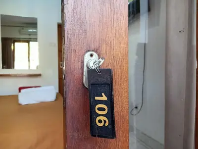 a door handle with the word office on it at Tama Seminyak Town House in Kerobokan