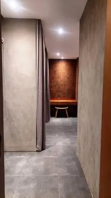 a hallway with a room with a table and a curtain at Villa Akhila 2 - 2 BR modern tropical villa at the heart of Seminyak in Seminyak