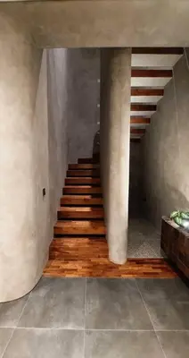 a staircase in a room with wooden floors and a stair case at Villa Akhila 2 - 2 BR modern tropical villa at the heart of Seminyak in Seminyak