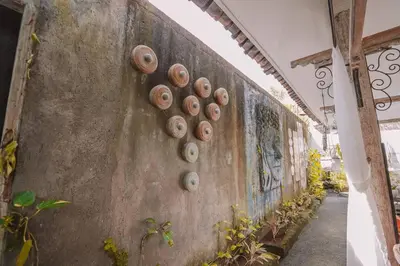 a wall with donuts on the side of a building at Bohemian Kasya Villa Bali in Seminyak