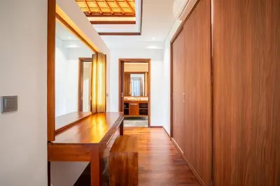 a hallway with a wooden bench in a house at Bali - Jimbaran Beach Villa Private Pool in Jimbaran