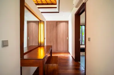 a hallway with a wooden table in a house at Bali - Jimbaran Beach Villa Private Pool in Jimbaran