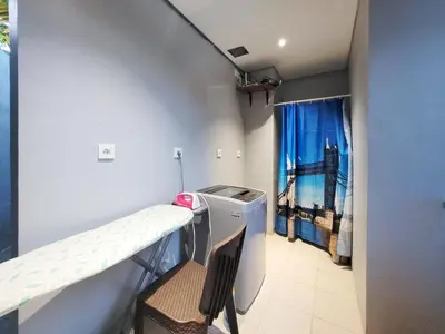 a hospital room with a ladder and a washing machine at Bali - Jimbaran Beach Villa Private Pool in Jimbaran