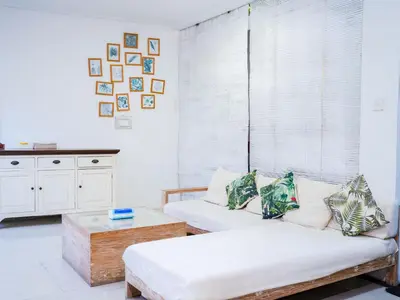 a living room with a couch and a table at Massive 3 bedroom villa in heart of Seminyak in Seminyak