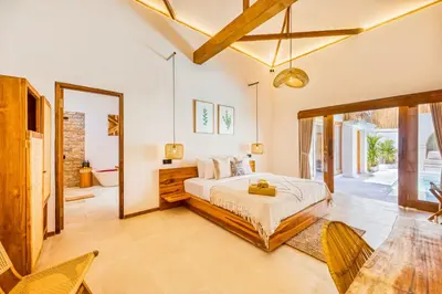 a bedroom with a bed and a large mirror at Villa Waikiki - Brand New 4BDR with huge Pool in Seminyak
