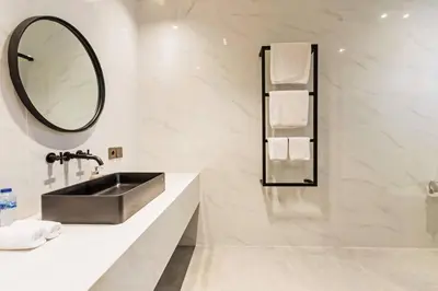 a bathroom with a sink and a mirror at Manresa Villa Bali 4 in Canggu