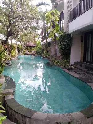 a swimming pool in front of a building at LBV Seminyak Apartment in Seminyak