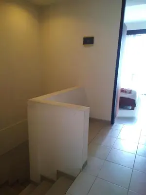 a staircase in a room with a window at LBV Seminyak Apartment in Seminyak