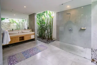 a bathroom with two sinks and a shower at Villa Becca 4 Bedroom at Seminyak near to the Beach in Seminyak