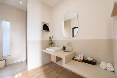 a bathroom with a sink and a mirror at Canggu Villa Go by Nagisa Bali in Canggu