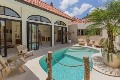 a pool in the backyard of a house at VILLA SALEYA with JACUZZI in Canggu