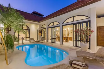 a swimming pool in the backyard of a house at VILLA SALEYA with JACUZZI in Canggu