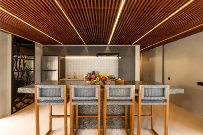 a kitchen with a dining table and chairs at Navya Villas in Canggu