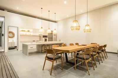 a kitchen and dining room with a table and chairs at Chic 4BR Villa, Canggu Hub, 800m to Beach Bliss in Canggu