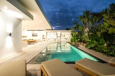 an indoor swimming pool in a villa with a house at Chic 4BR Villa, Canggu Hub, 800m to Beach Bliss in Canggu