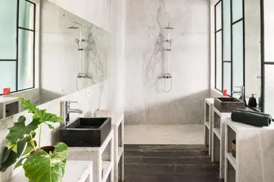 a bathroom with two sinks and a shower at Villa Ruku-Ruku - Modern 1BR Villa with AC Living Room & Private Pool - French Style Interior in Kerobokan