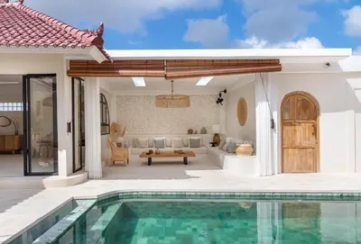 a villa with a swimming pool and a living room at Casa Adem - Modern & Trendy 3BR Villa in Seminyak, 10 Minutes to the Beach with Private Pool in Seminyak