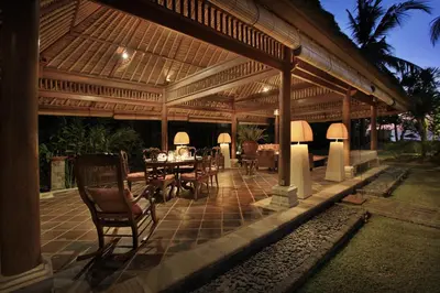a pavilion with a table and chairs on a patio at Villa Hanani in Jimbaran