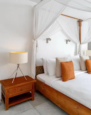 a bedroom with two beds and a table with a lamp at Villa Ace - Modern 2BR Villa in Seminyak with Spacious Bedrooms, Bathtub & Private Pool in Seminyak