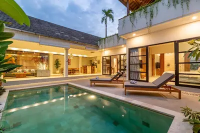 an indoor swimming pool in the backyard of a house at Villa Elea - Bright & Modern 2BR Villa in Seminyak with Private Pool and Sunset Rooftop in Seminyak