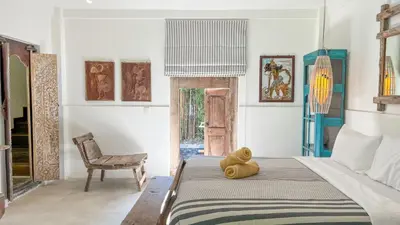 a teddy bear sitting on a bed in a room at Villa Nak - Charming 4BR Family-Friendly Villa, Walking Distance to Seminyak Beach in Seminyak