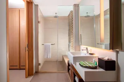a bathroom with a sink and a shower at Courtyard by Marriott Bali Seminyak Resort in Seminyak