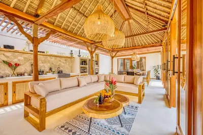 a living room with a couch and a table at Villa Tango - New Luxurious 7BDR Prime Location in Seminyak