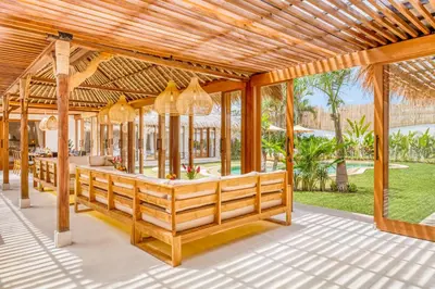 an outdoor patio with a pavilion with chandeliers at Villa Tango - New Luxurious 7BDR Prime Location in Seminyak
