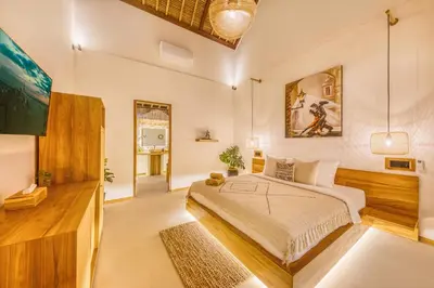 a bedroom with a king sized bed in a room at Villa Tango - New Luxurious 7BDR Prime Location in Seminyak
