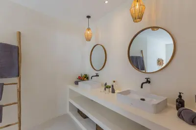 a bathroom with two sinks and a mirror at Villa Alamanda Maya Seminyak center 2 bedr with private Pool in Seminyak