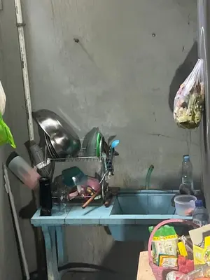 a kitchen counter with a sink next to a sink at Villa Sipaling in Pesanggaran