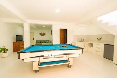 a living room with a pool table in it at Spacious 3 BR Villa with private pool and Billiards in Seminyak