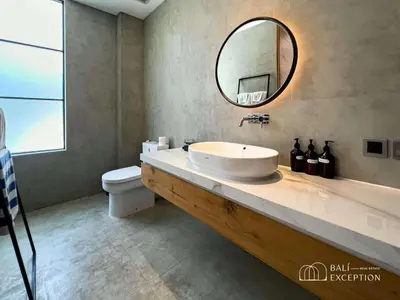 a bathroom with a sink and a mirror at Three-Bedroom Pool Villa at Anwa Residences in Canggu