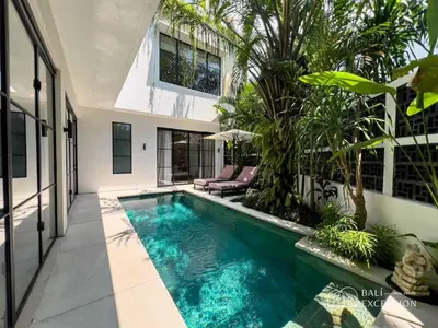 a swimming pool in the backyard of a house at Three-Bedroom Pool Villa at Anwa Residences in Canggu