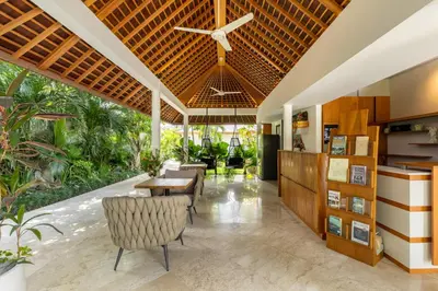 a dining room with a table and chairs at Three-Bedroom Pool Villa at Anwa Residences in Canggu