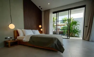 a bedroom with a large bed and a large window at Three-Bedroom Pool Villa at Anwa Residences in Canggu