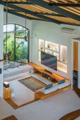 a living room with a couch and a tv at Casa Donilo - 4BR Designer Villa in Canggu in Canggu