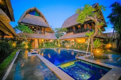 an exterior view of a villa with a swimming pool at Radiant Jepun Villa in Legian