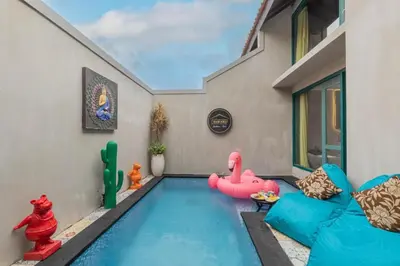 a small swimming pool with a inflatable pool noodle at Mezzanine Industrial 1 Bedroom Private Villa in Seminyak in Seminyak