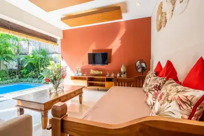 a living room with a couch and a table at New Villa Lotus 2BR Private Pool Villas in Seminyak