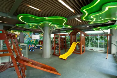 a play room with a slide and a playground at Platinum Hotel Jimbaran Beach Bali in Jimbaran