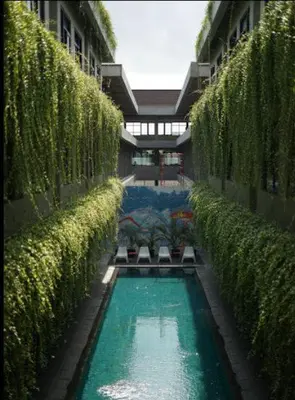 a swimming pool in the middle of a building at LBV Ambengan Tenten in Denpasar