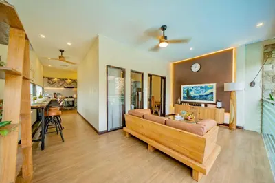 a living room with a couch and a table at Villa Domino - *NEW* Luxurious 2BR w/ Pool @Central Seminyak in Seminyak