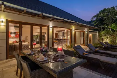 a dining room with a table and chairs at Villa 500m2 with 14m Pool, BBQ, Pinball - Seminyak in Seminyak